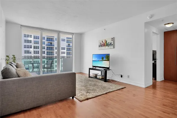 a living room with furniture and a window