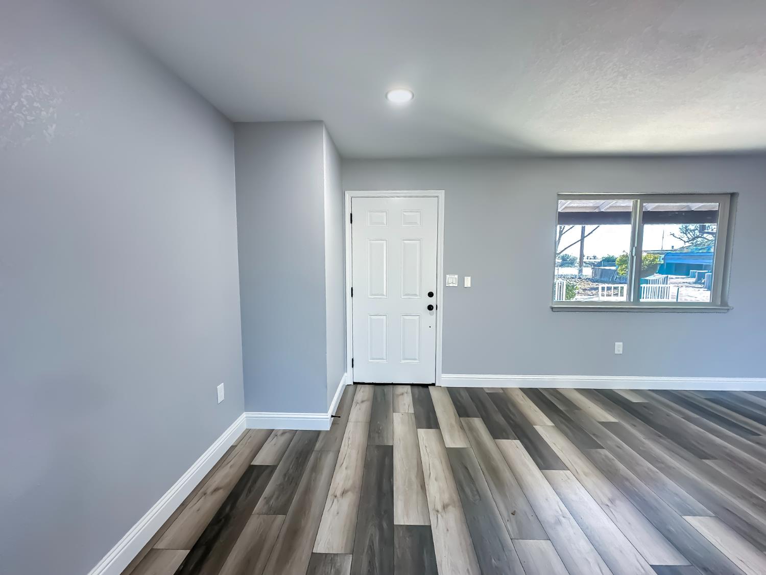 4804 Powerline Road Olivehurst, CA 95961 - Photo 14 of 65 wooden floor in an empty room with a window