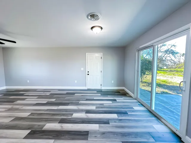 a view of an entryway with wooden floor and staircase
