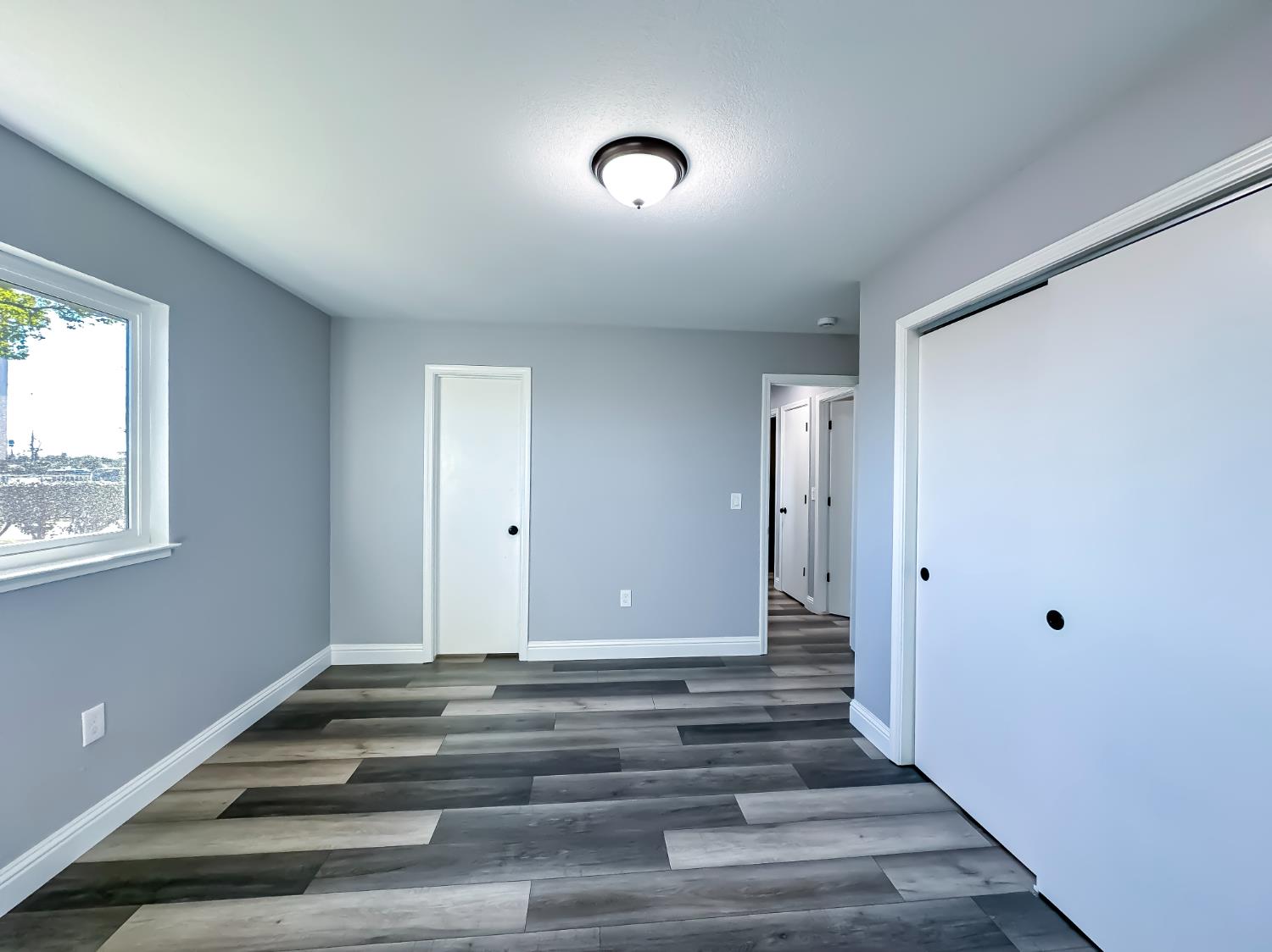 4804 Powerline Road Olivehurst, CA 95961 - Photo 33 of 65 a view of an entryway with wooden floor and a window