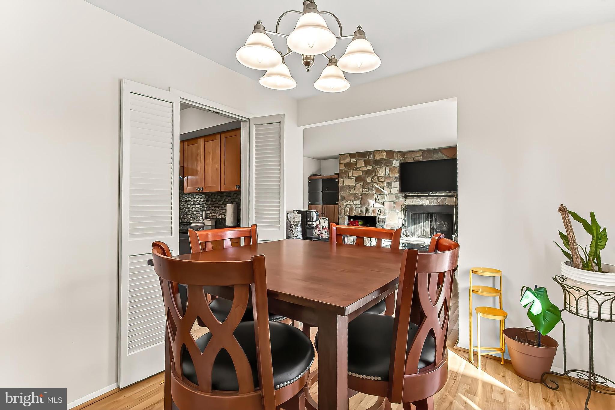 1809 Ivy Oak Square, Unit 61 Reston, VA 20190 - Photo 14 of 38 a view of a dining room with furniture window and wooden floor