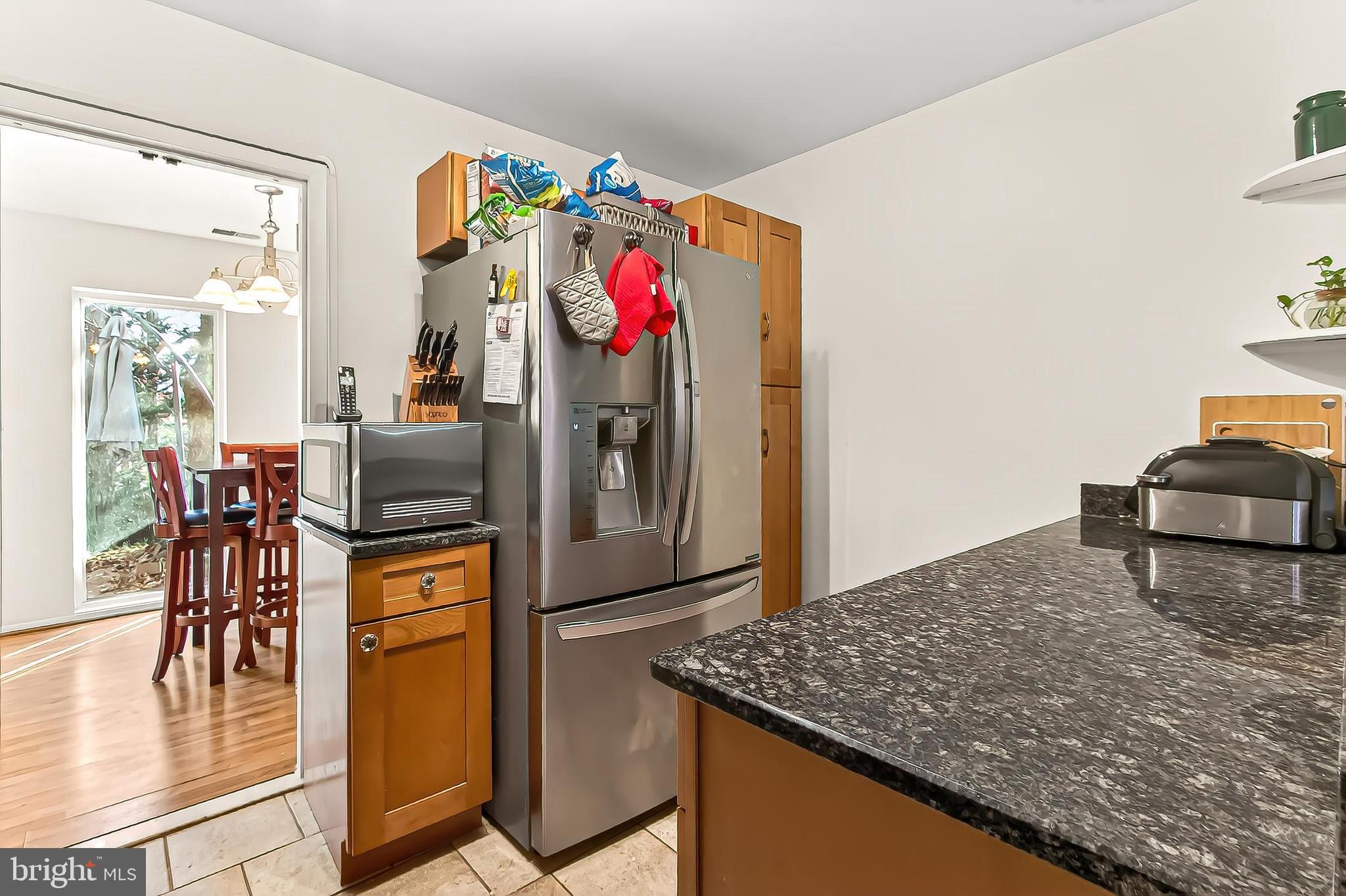 1809 Ivy Oak Square, Unit 61 Reston, VA 20190 - Photo 16 of 38 a kitchen with stainless steel appliances granite countertop a sink a stove and a refrigerator