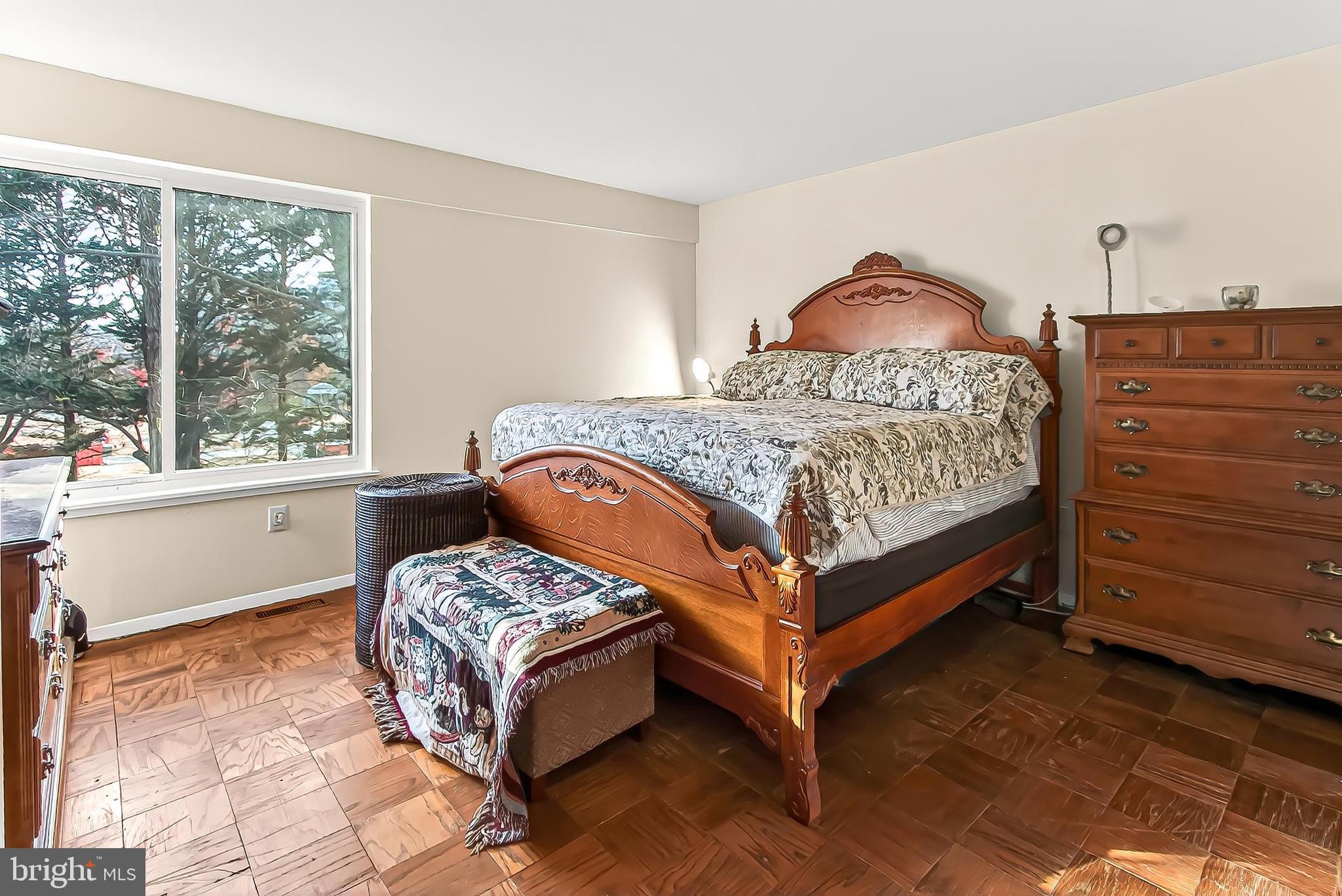 1809 Ivy Oak Square, Unit 61 Reston, VA 20190 - Photo 24 of 38 a bedroom with a bed and window