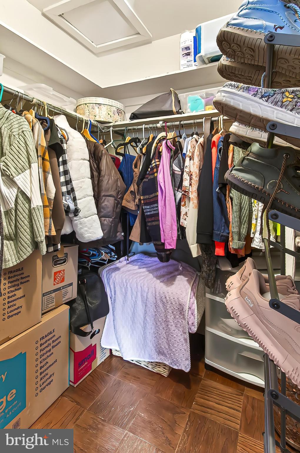 1809 Ivy Oak Square, Unit 61 Reston, VA 20190 - Photo 28 of 38 a view of walk in closet with clothes and shoes