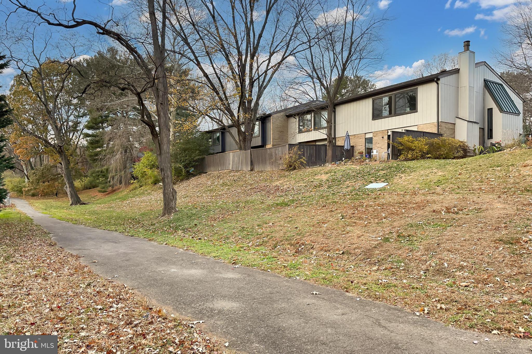 1809 Ivy Oak Square, Unit 61 Reston, VA 20190 - Photo 38 of 38 a view of a yard with a house covered with snow