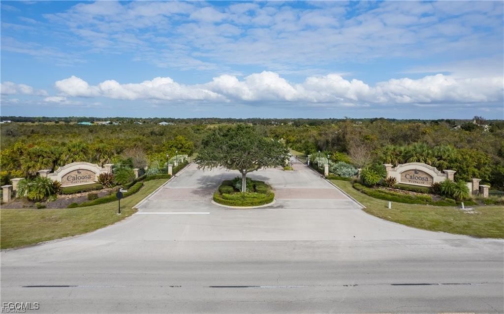 22797 Yellow Button Lane Alva, FL 33920 - Photo 2 of 13 a view of a terrace with a garden and mountain view