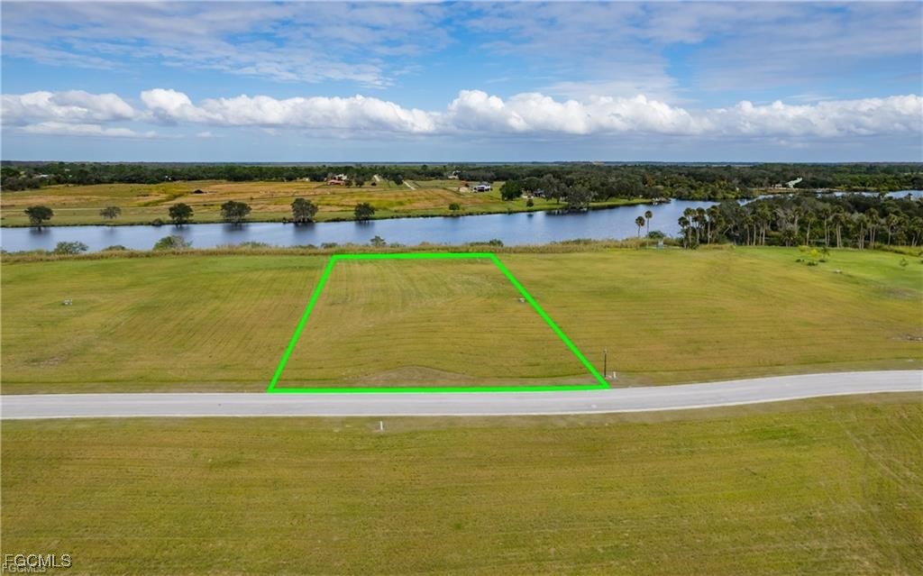 22797 Yellow Button Lane Alva, FL 33920 - Photo 4 of 13 a view of an swimming pool and an outdoor space