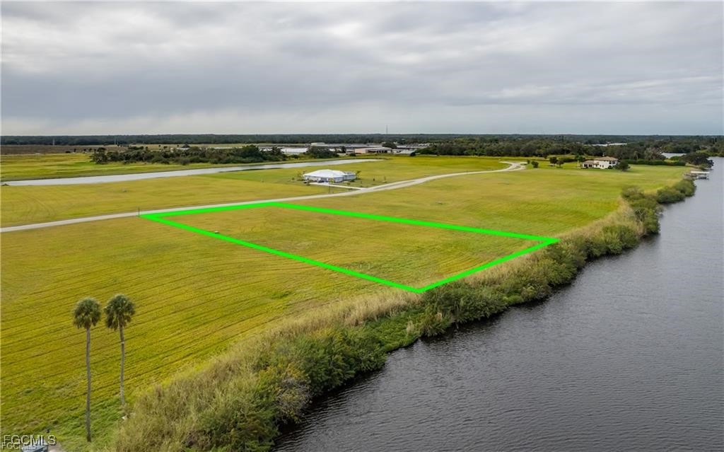 22797 Yellow Button Lane Alva, FL 33920 - Photo 8 of 13 a view of a swimming pool and an outdoor seating