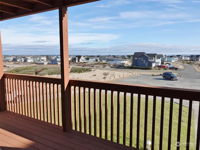 a view of a wooden chairs in a patio