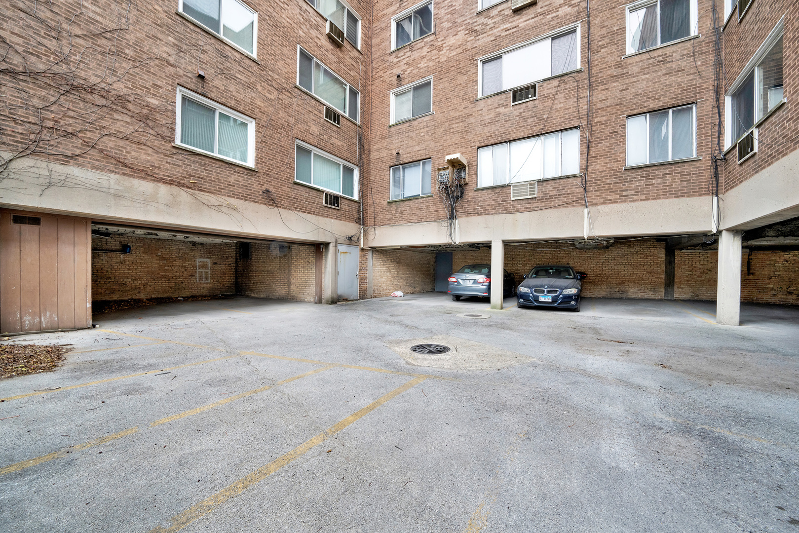 7120 North Sheridan Road, Unit 216 Chicago, IL 60626 - Photo 20 of 21 a view of a building with a street and a car parked beside a road