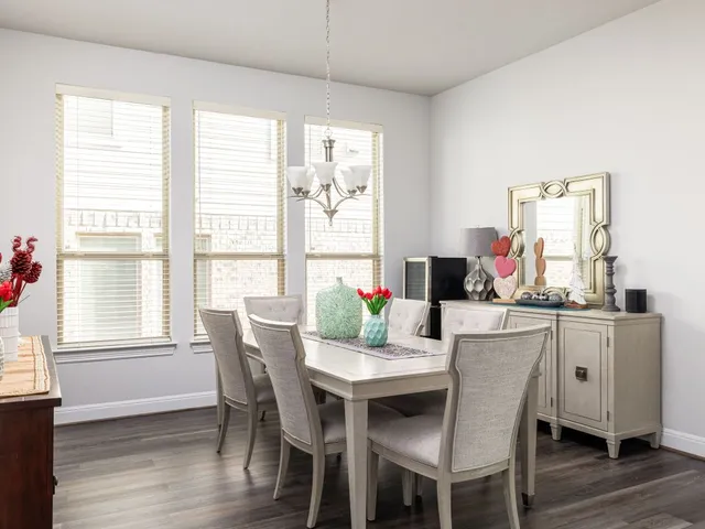 a kitchen with stainless steel appliances granite countertop a stove and a wooden floors