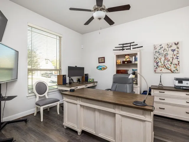 a bedroom with a large bed and a large window