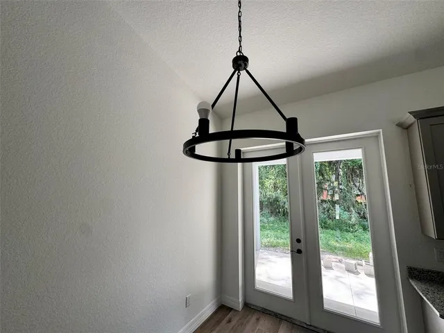 a view of a kitchen with a sink and cabinets