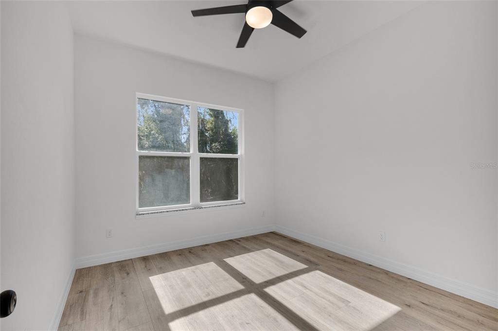 902 Southwest 2nd Street Ocala, FL 34471 - Photo 13 of 42 an empty room with a window