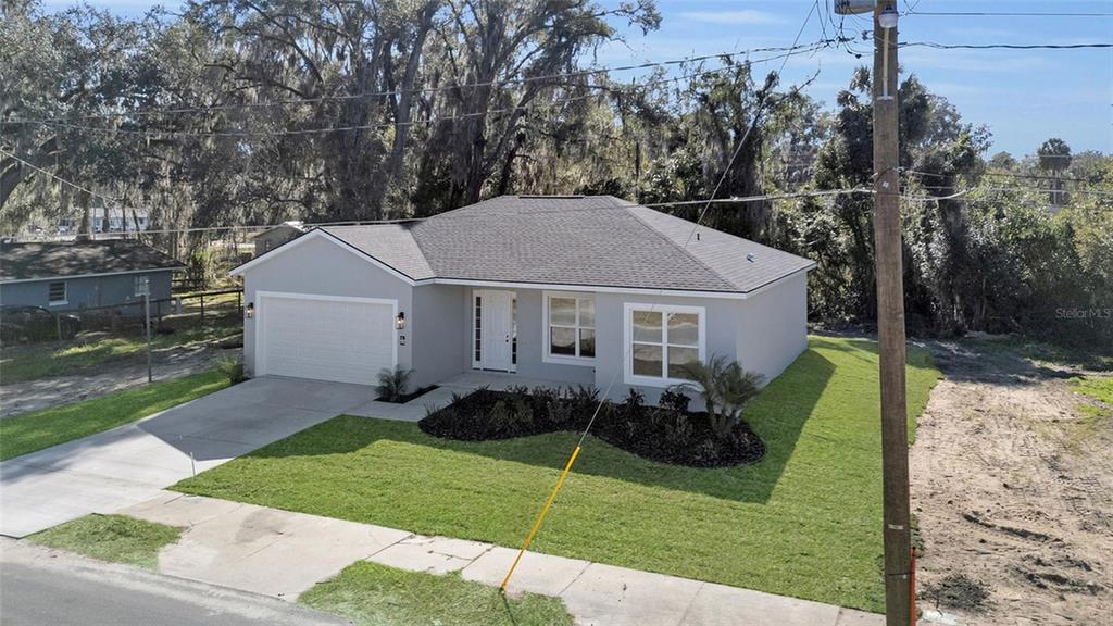 902 Southwest 2nd Street Ocala, FL 34471 - Photo 23 of 42 a view of a house with backyard and garden