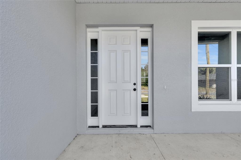 902 Southwest 2nd Street Ocala, FL 34471 - Photo 3 of 42 front view of a house with a door