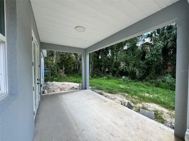 a view of a house with yard and a garden