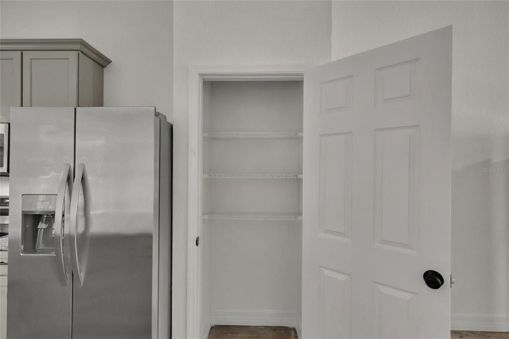 902 Southwest 2nd Street Ocala, FL 34471 - Photo 10 of 42 a bathroom with a glass shower door