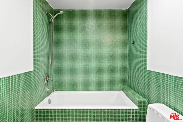 a view of an empty room with a fireplace