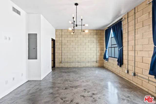 a bathroom with a glass shower door and a sink