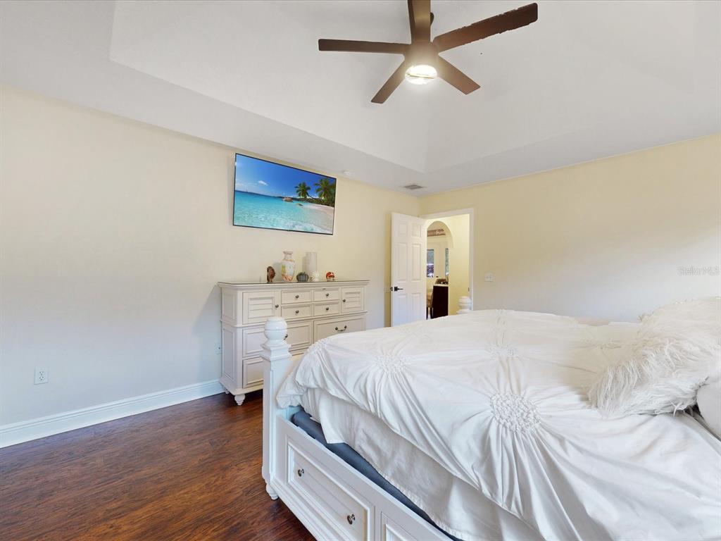 4775 Jay Drive St. Cloud, FL 34772 - Photo 17 of 49 a bedroom with a bed and a ceiling fan