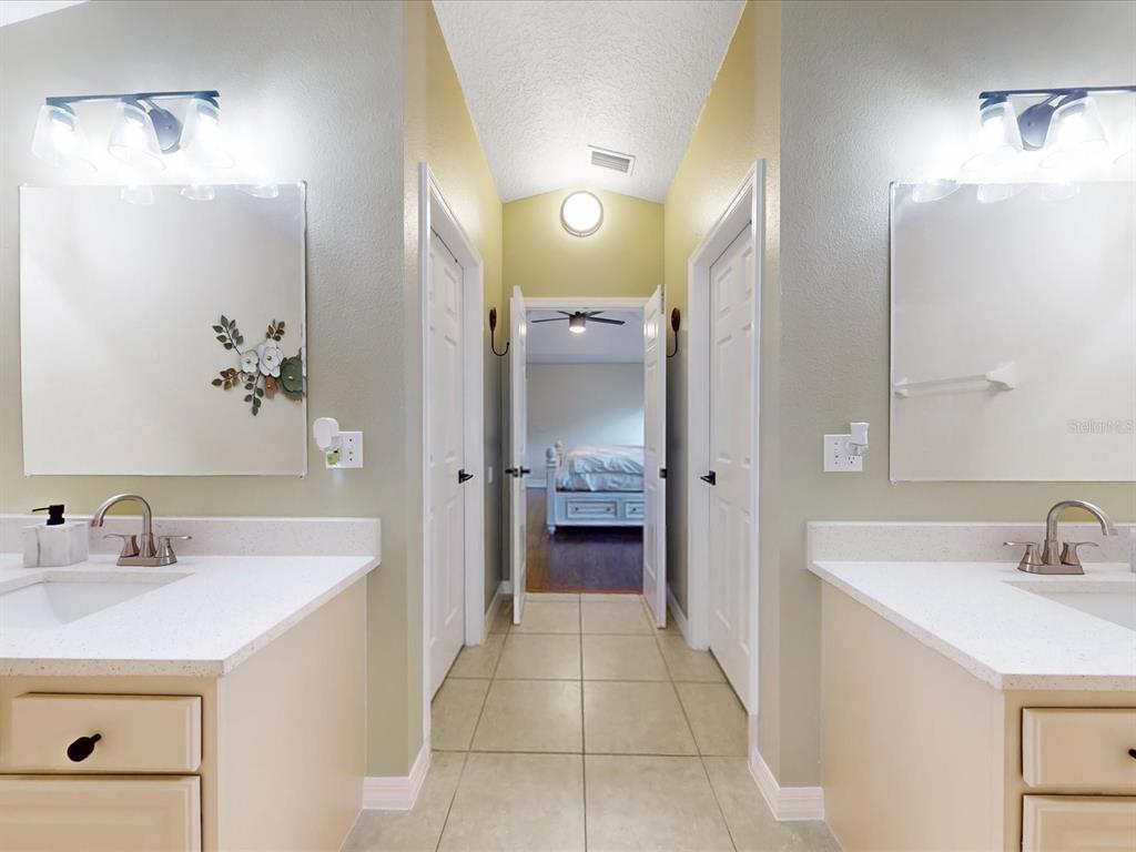 4775 Jay Drive St. Cloud, FL 34772 - Photo 20 of 49 a bathroom with a sink and a mirror