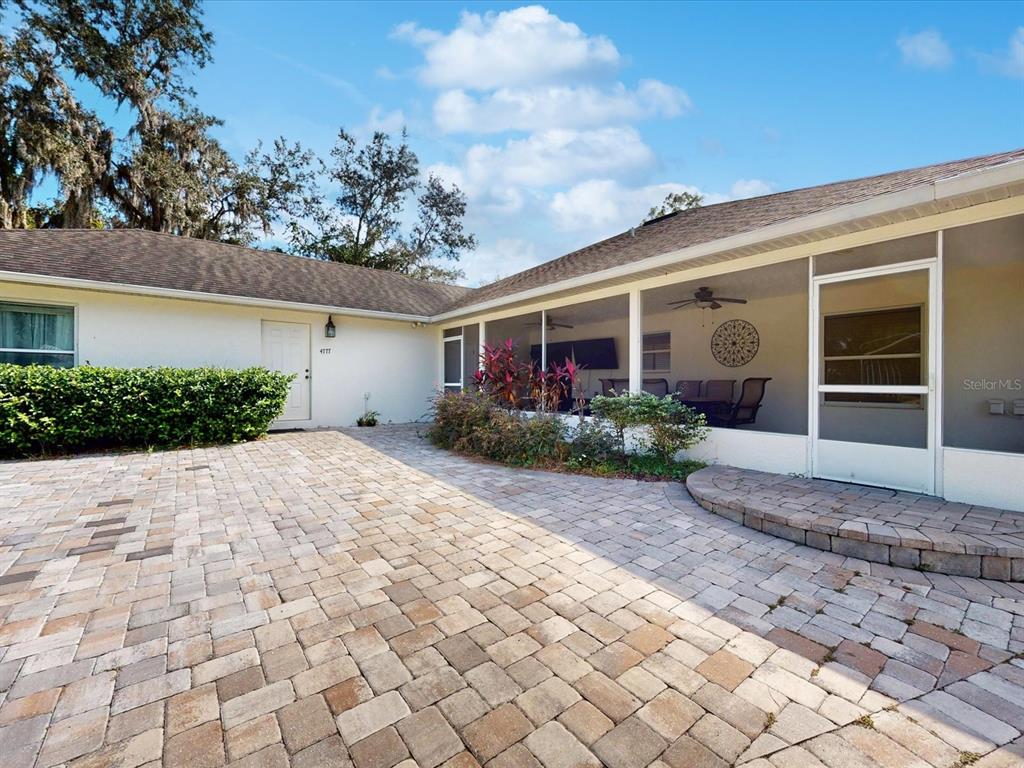 4775 Jay Drive St. Cloud, FL 34772 - Photo 32 of 49 a view of a house with a yard and potted plants