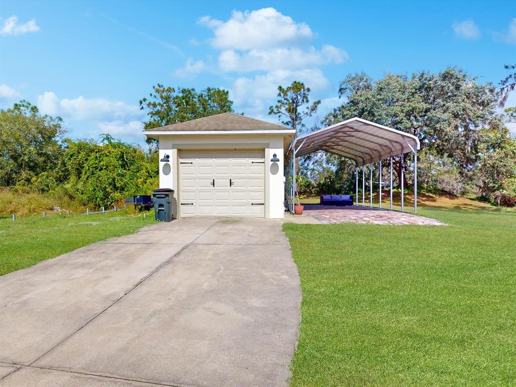 4775 Jay Drive St. Cloud, FL 34772 - Photo 39 of 49 a front view of a house with a yard