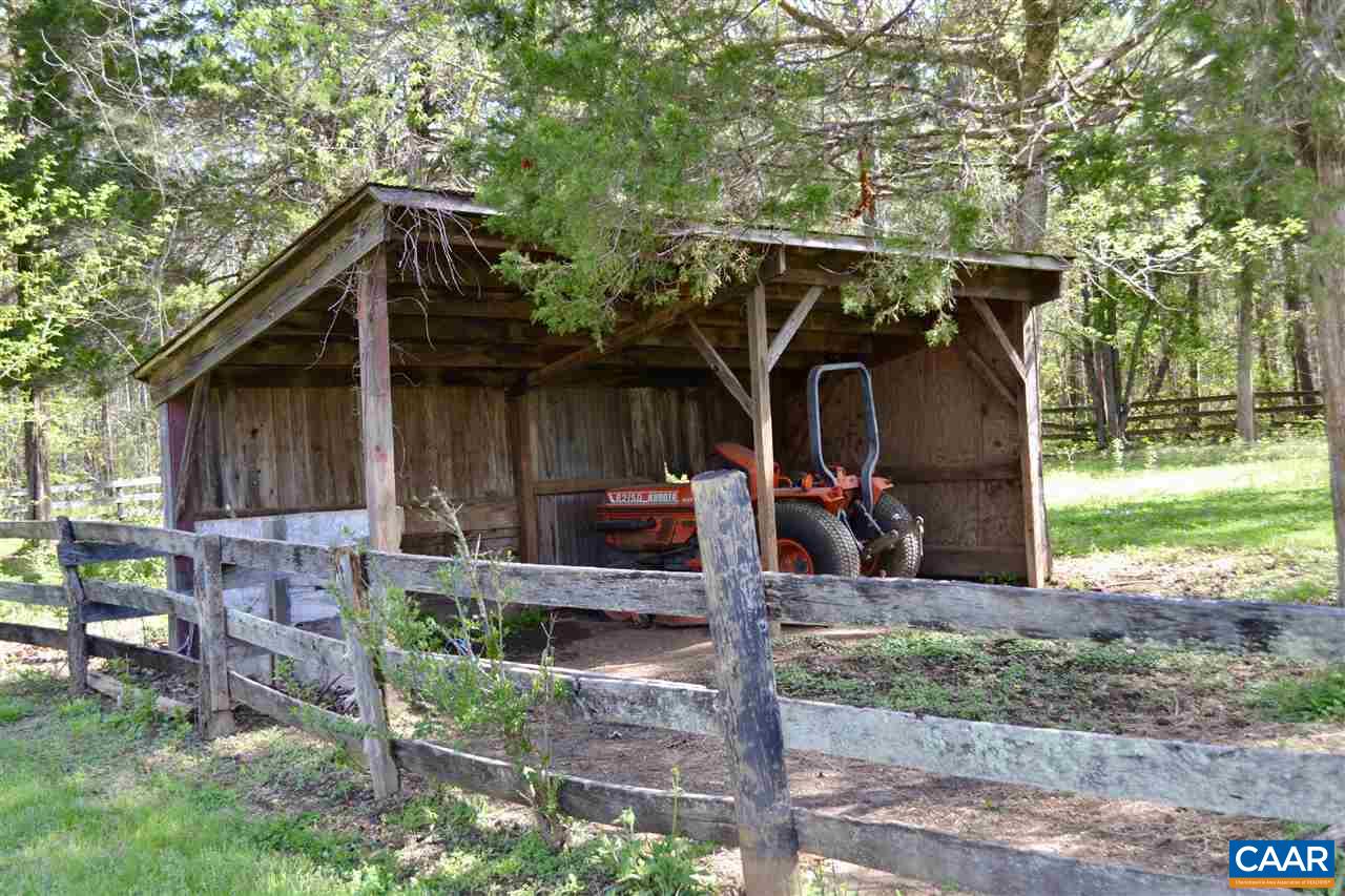 1400 Forest Clay Road Wingina, VA 24599 - Photo 14 of 19 a view of a wooden house with a small yard and a large tree