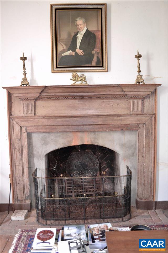 1400 Forest Clay Road Wingina, VA 24599 - Photo 4 of 19 a fireplace with a vase on top of it