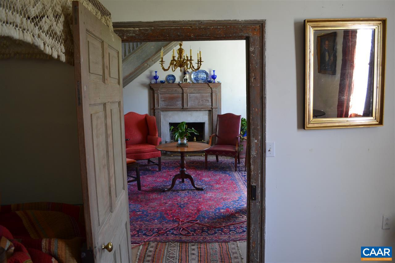 1400 Forest Clay Road Wingina, VA 24599 - Photo 5 of 19 a living room with furniture and a painting on the wall