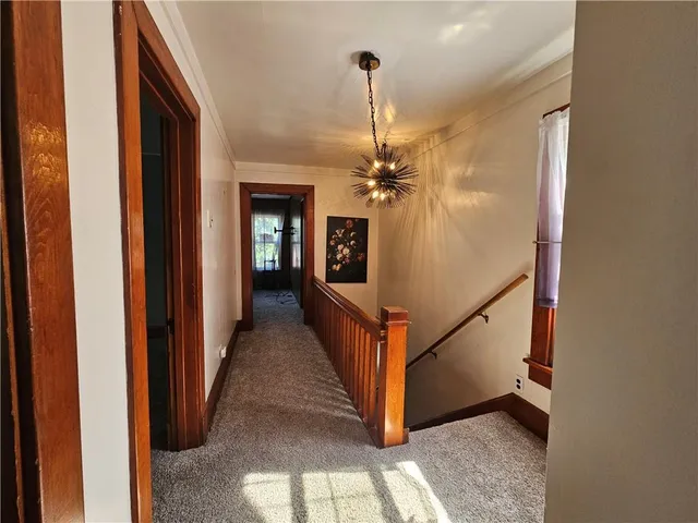 a view of a hallway with windows