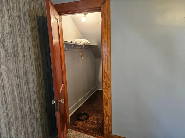 a bathroom with a glass shower door and a mirror