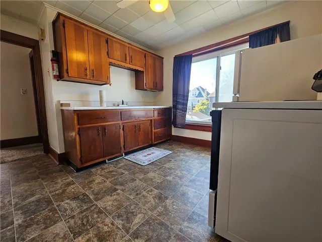 a view of a kitchen with furniture and a window