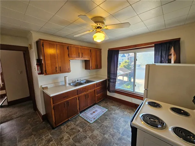 a kitchen with a stove and a sink