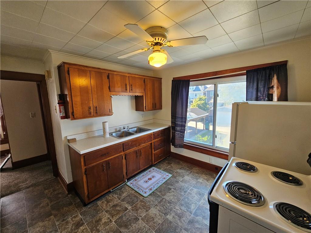 1127 Highland Street, Unit 2 Tarentum, PA 15084 - Photo 7 of 24 a kitchen with a stove and a sink