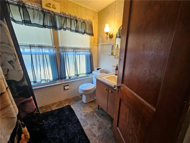 a bathroom with a sink and mirror