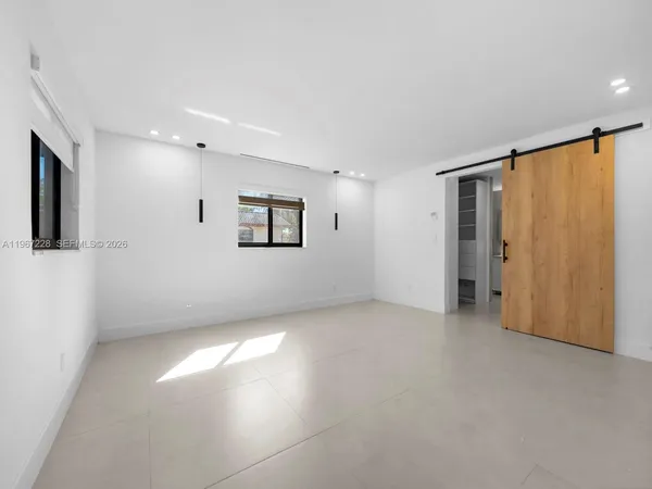 a view of an empty room with a window