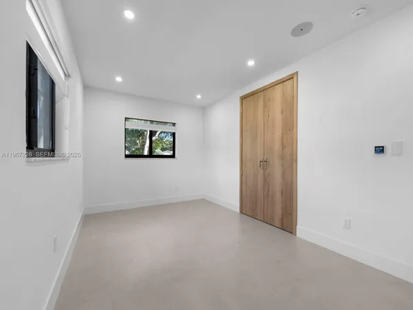 an empty room with windows