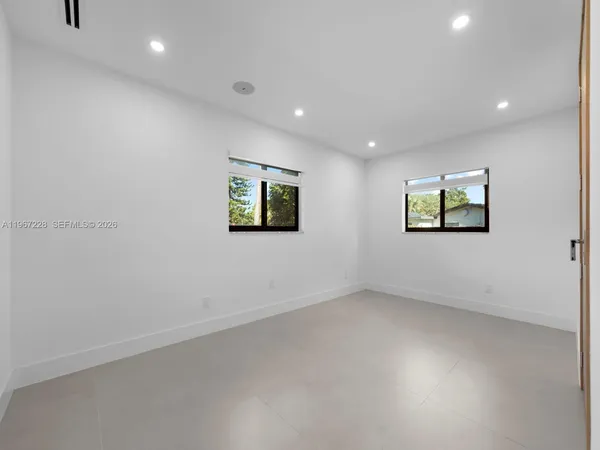 an empty room with windows