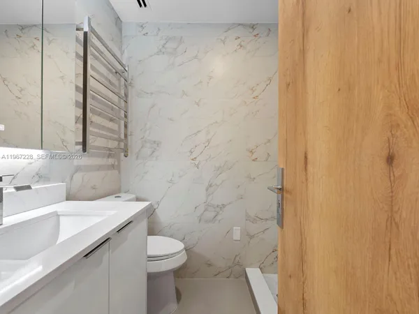 a bathroom with a sink and a toilet