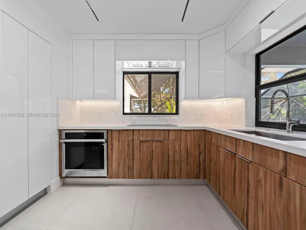 a kitchen with a cabinets and window