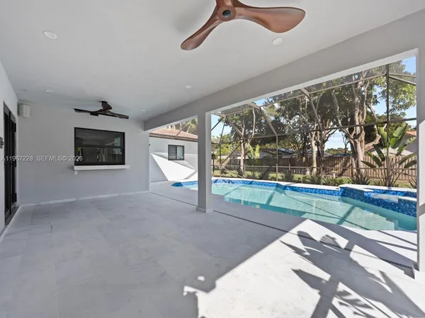 a view of a room with window and furniture