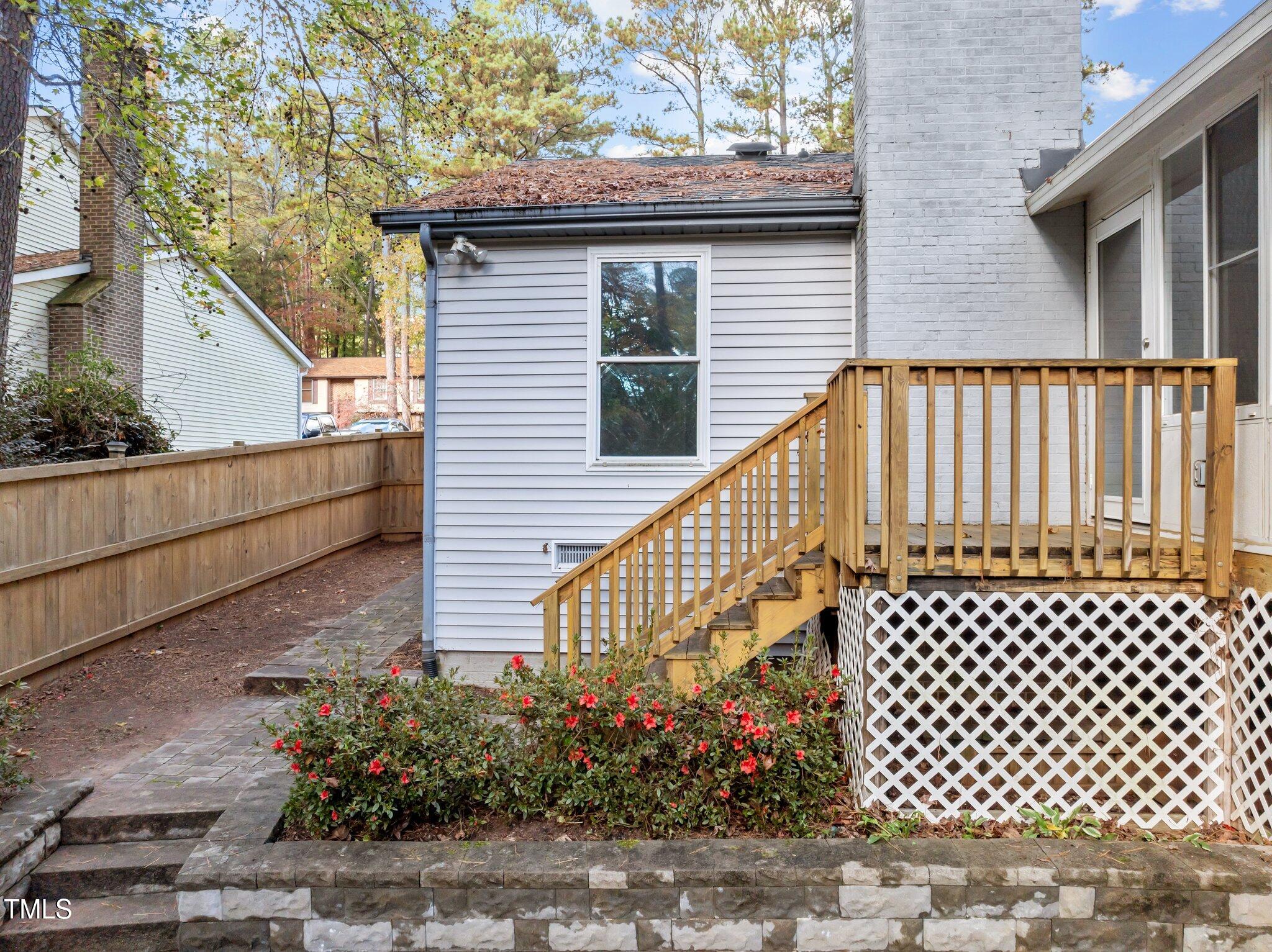 1009 Whetstone Court Raleigh, NC 27615 - Photo 26 of 32 Deck Steps down to Backyard