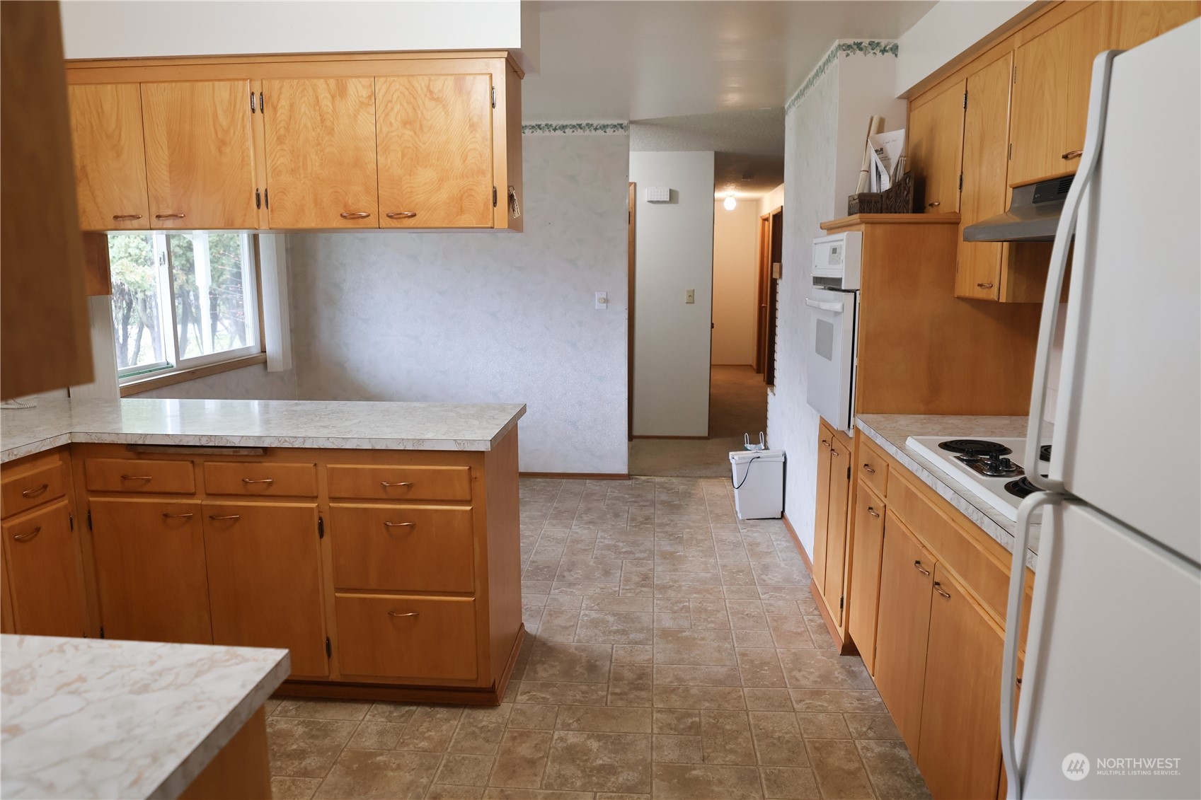 116 Silver Drive Electric City, WA 99123 - Photo 12 of 27 a kitchen with stainless steel appliances granite countertop a refrigerator a stove and a sink