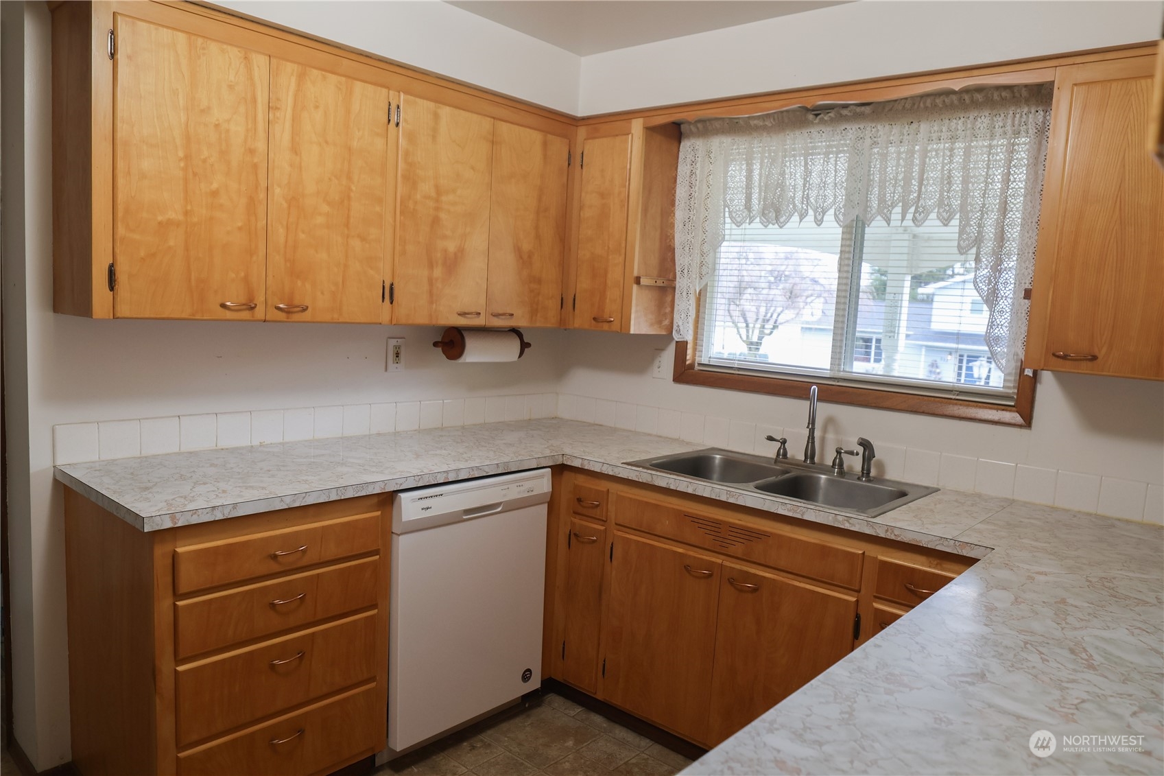 116 Silver Drive Electric City, WA 99123 - Photo 14 of 27 a kitchen with a sink cabinets and window