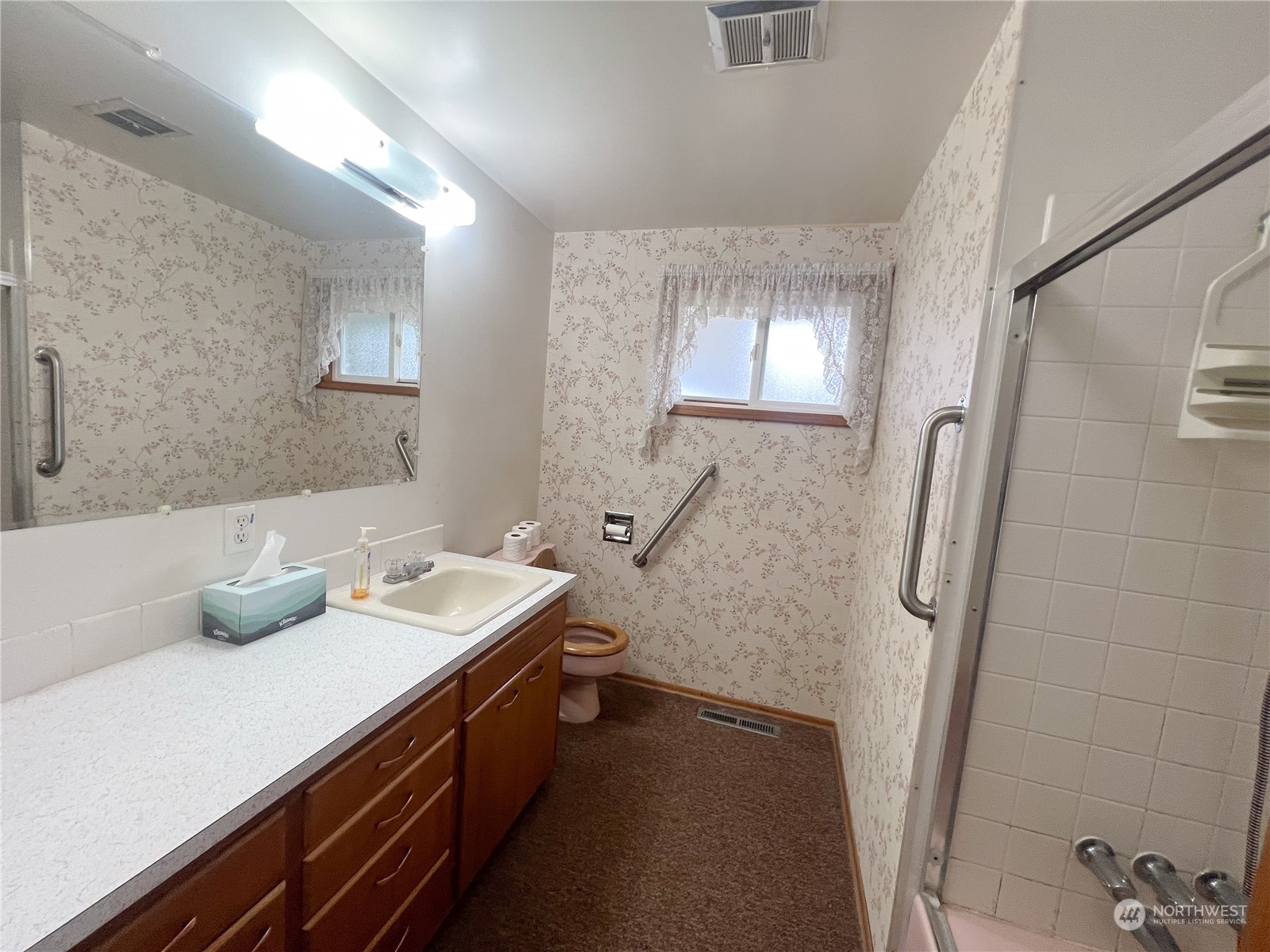 116 Silver Drive Electric City, WA 99123 - Photo 16 of 27 a bathroom with a sink double vanity and a mirror
