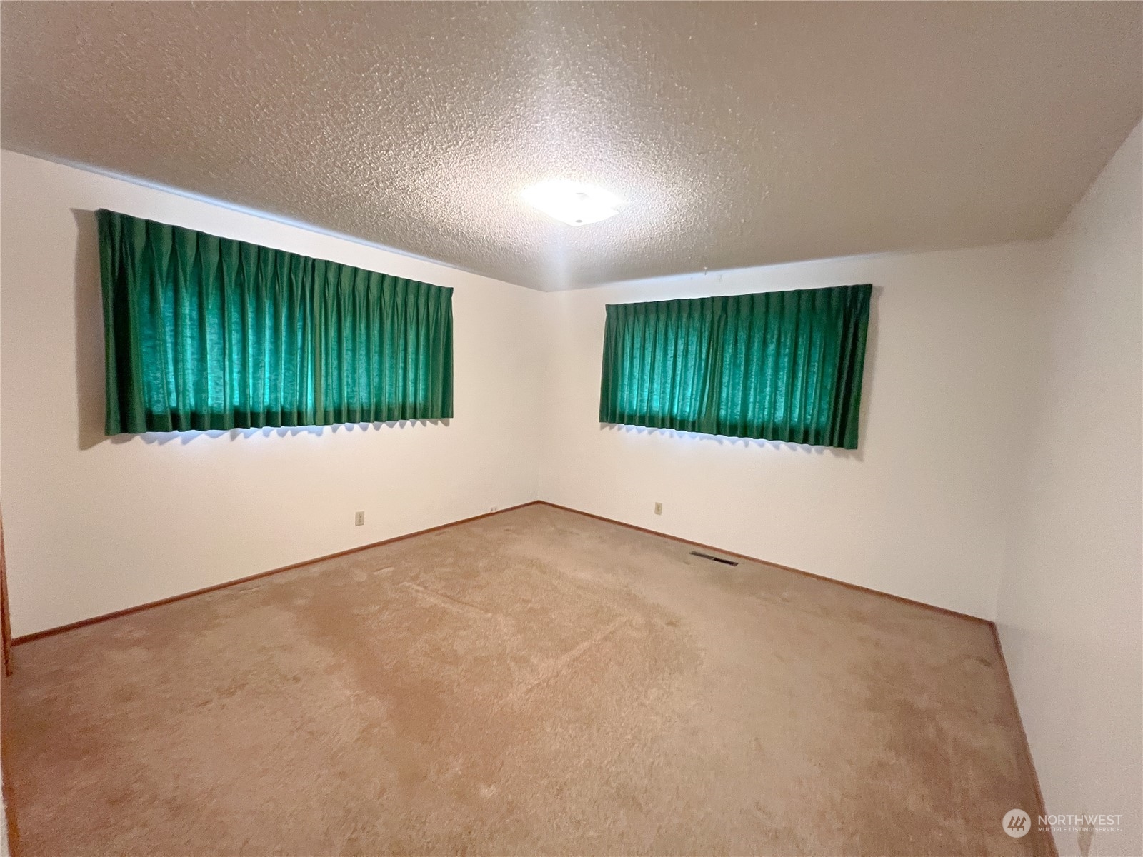 116 Silver Drive Electric City, WA 99123 - Photo 18 of 27 an empty room with a window and stairs