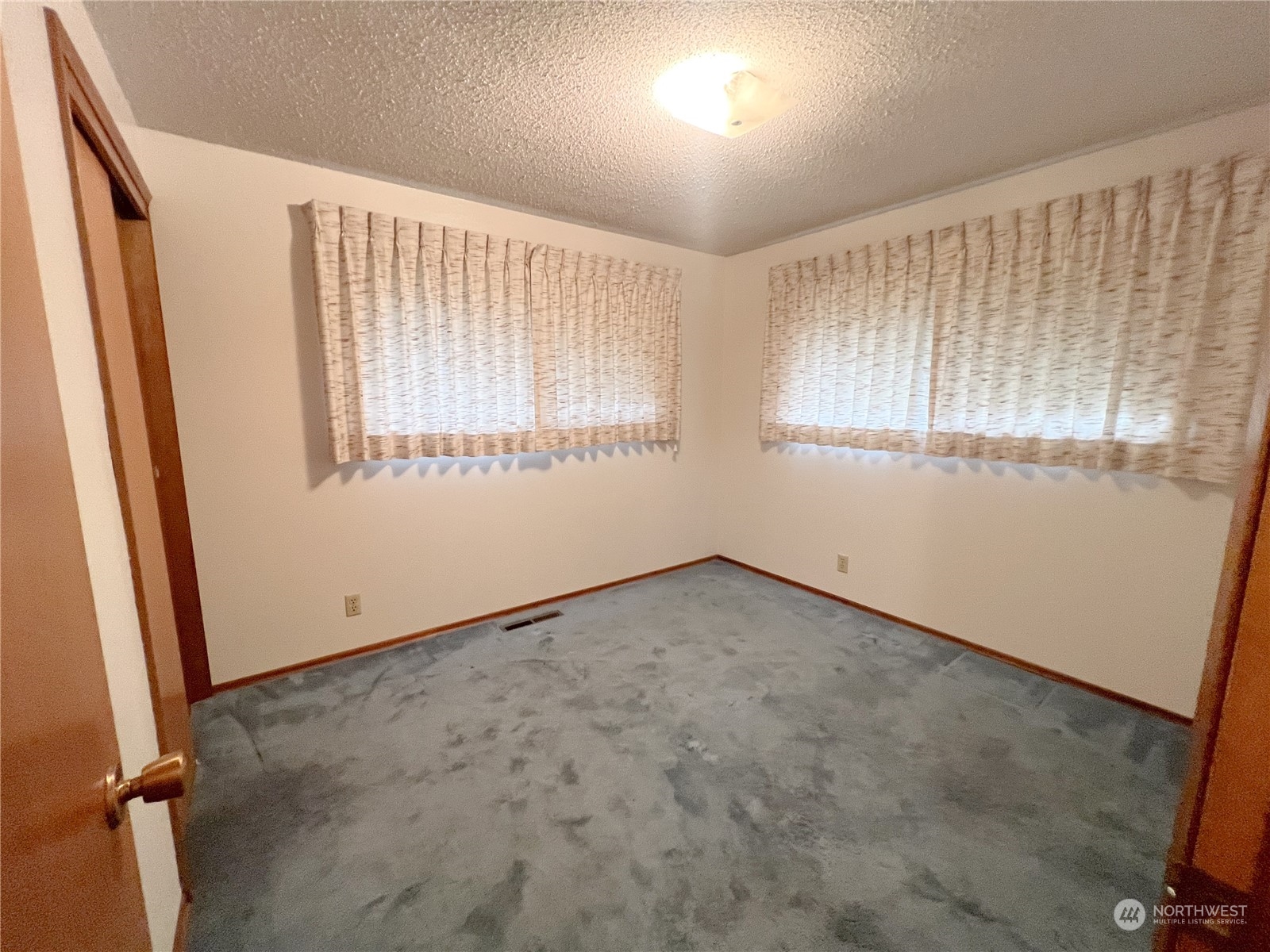 116 Silver Drive Electric City, WA 99123 - Photo 20 of 27 an empty room with windows