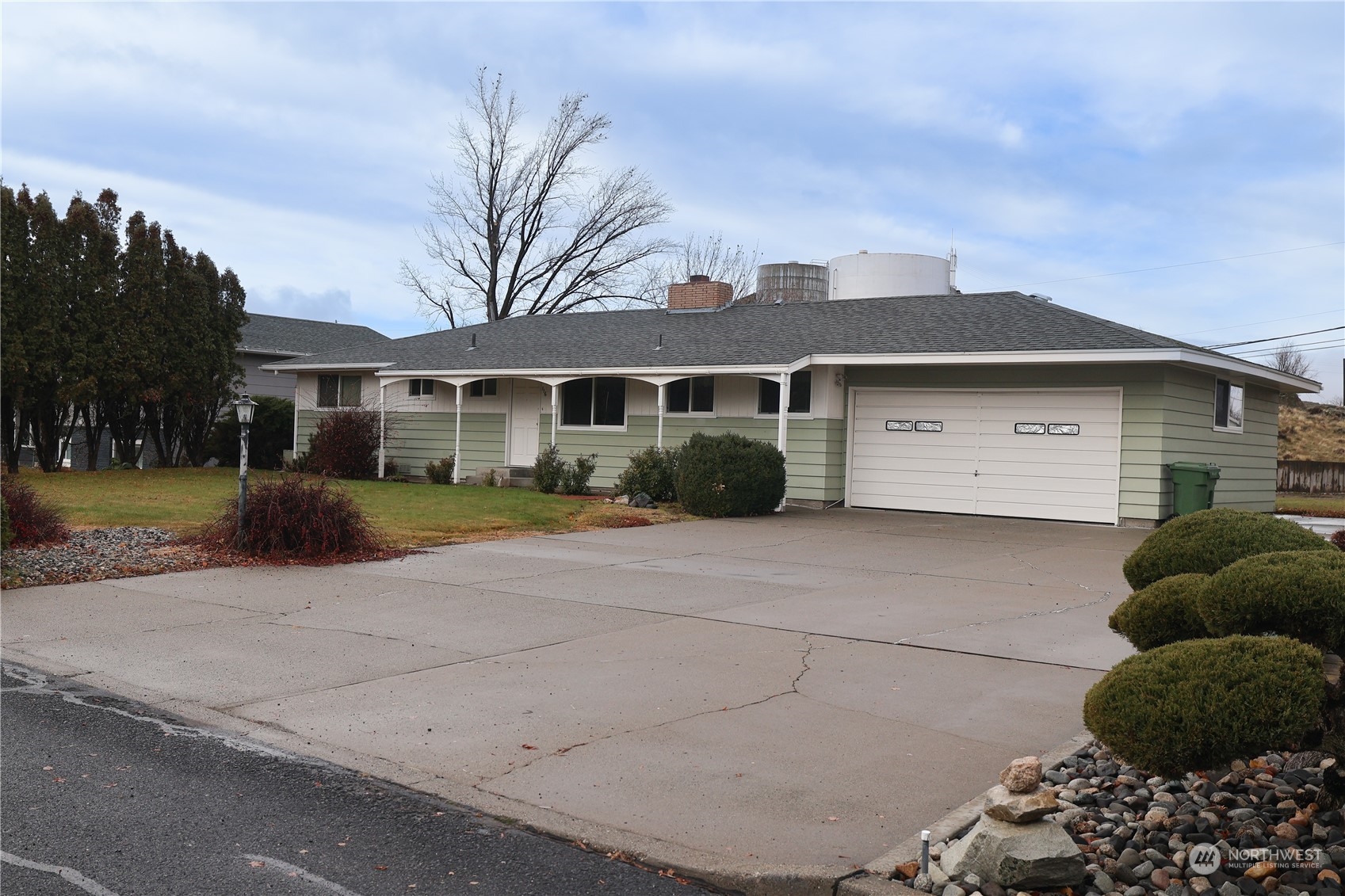 116 Silver Drive Electric City, WA 99123 - Photo 2 of 27 a front view of a house with a yard and garage